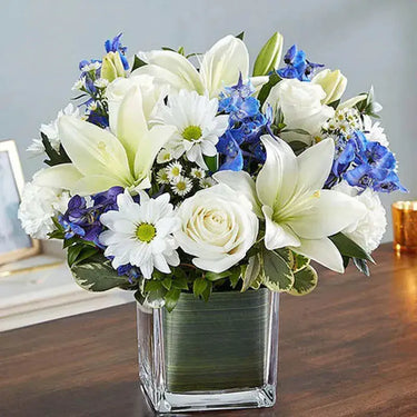 Healing Sorrow, Blue and White Floral Comfort, White Oriental Lilies, Roses, Carnations, Delphinium, Chrysanthemums